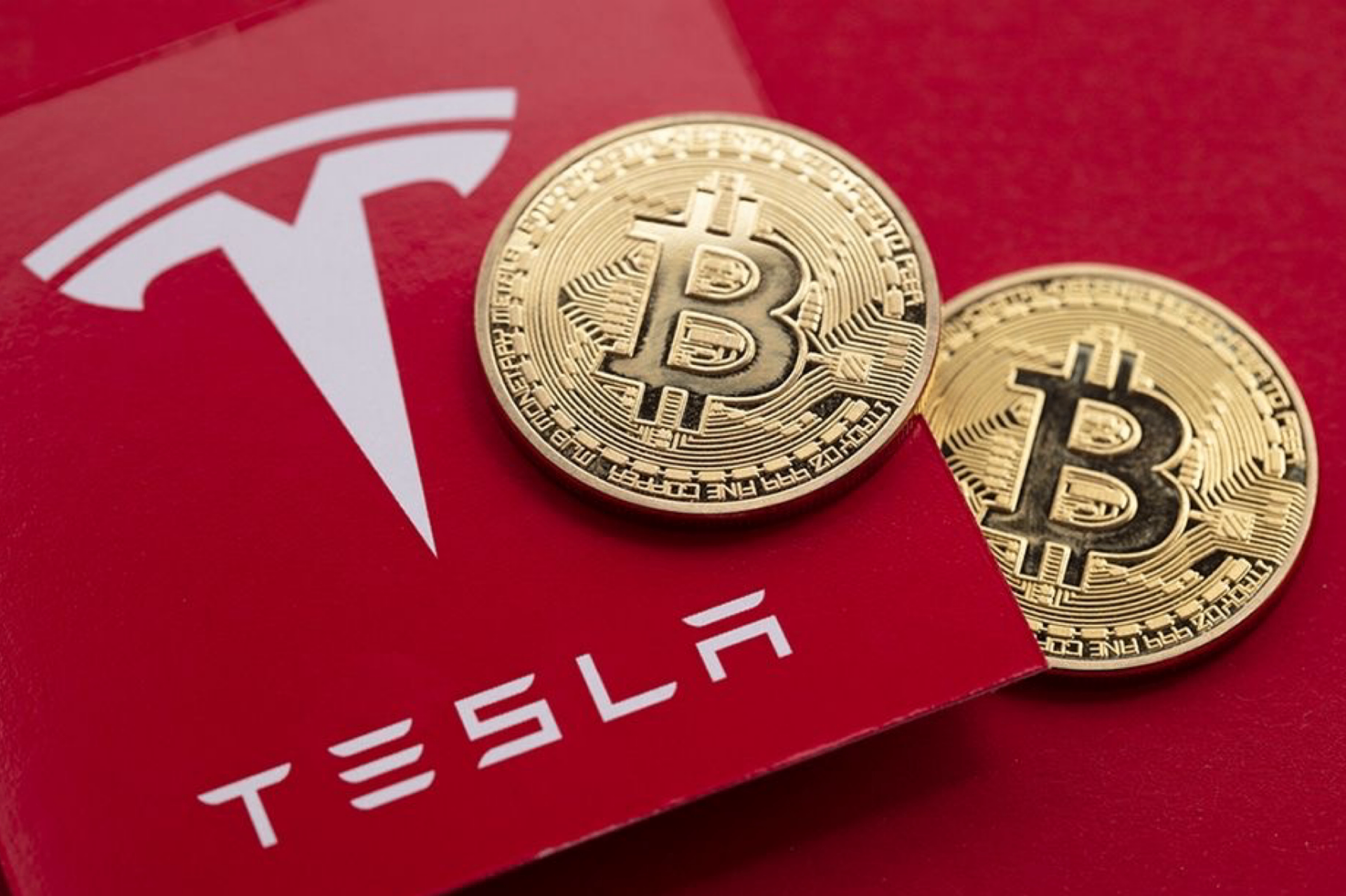 Tesla card with two Bitcoin coins
